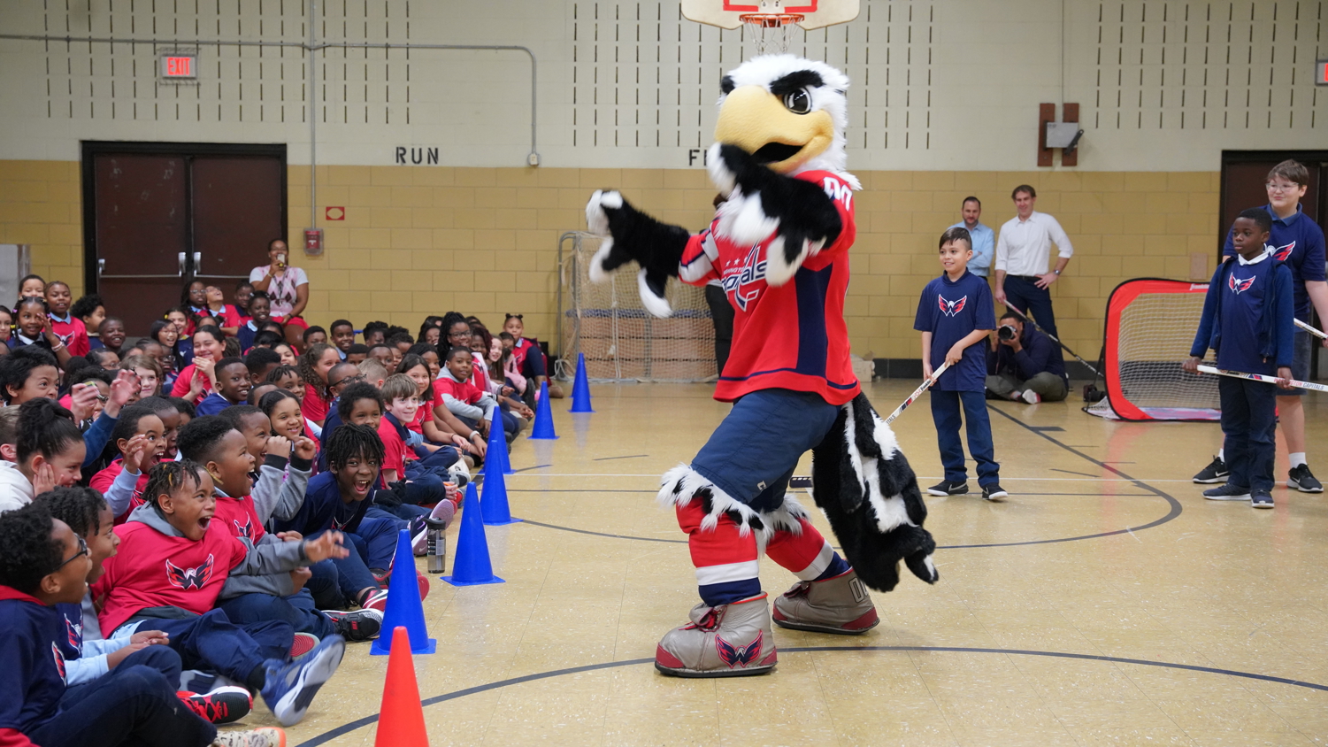 Washington Capitals mascot performing for students