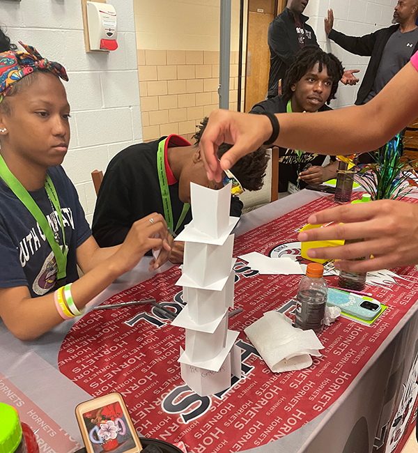 students building card tower