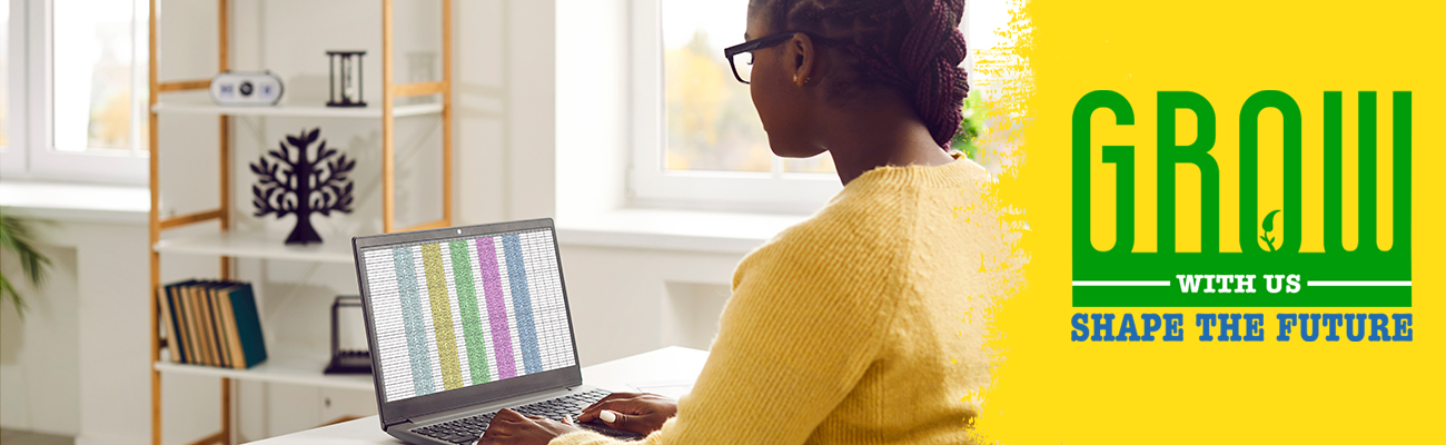 adult typing into a spreadsheet on a laptop computer - Grow with us, Shape the future